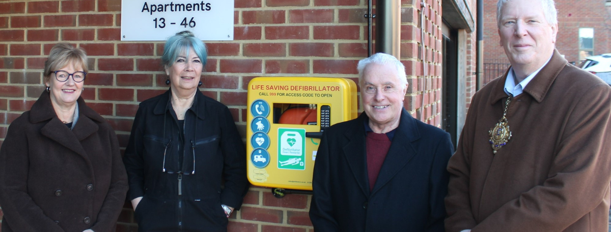 unveiling of the defibrillator at Danemore is, from l-r, Ashford Borough Council Chief Executive Tracey Kerly, residents Susanne Lynch and David Marsh, and Mayor of Tenterden, Cllr John Crawford