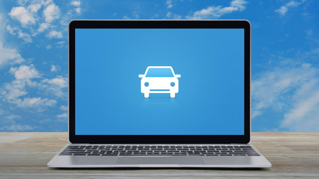 Laptop displaying a car icon