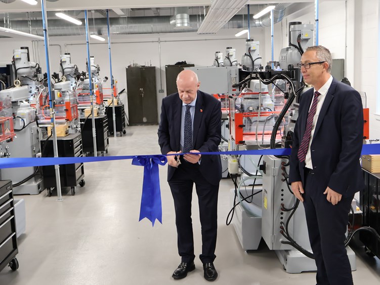 Damian Green MP cuts the ribbon watched by EKC CEO Graham Razey