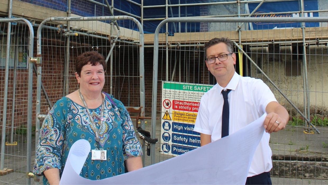 Bill Barrett and Sharon Williams, the council’s Assistant Director of Housing, at Court Wurtin studying plans for the ongoing refurbishment