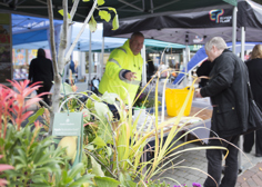 People talking at a stall