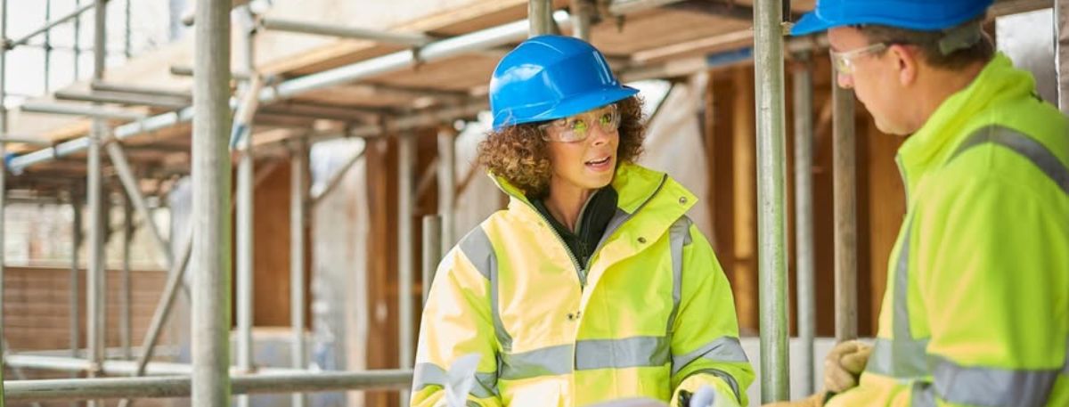 People talking at a construction site