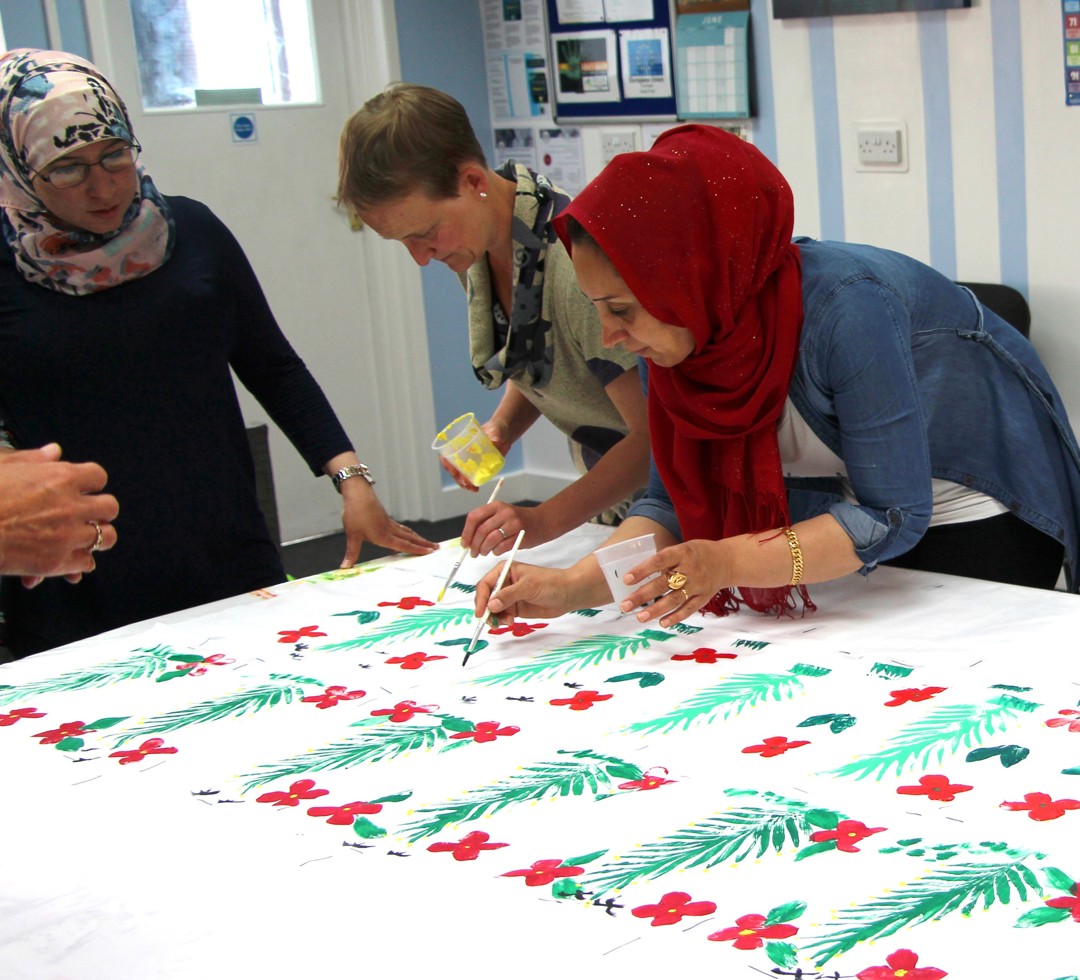 photo from the Syrian Home Project with one attendee painting
