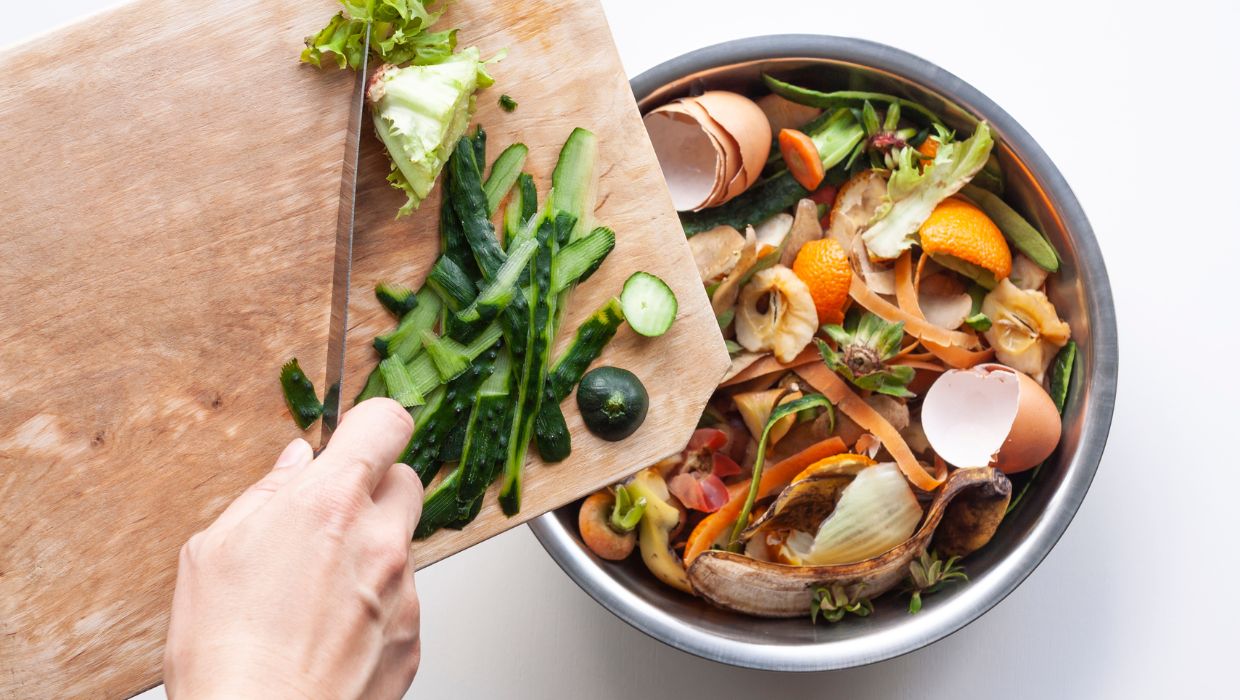 Food being scrapped in a food caddy