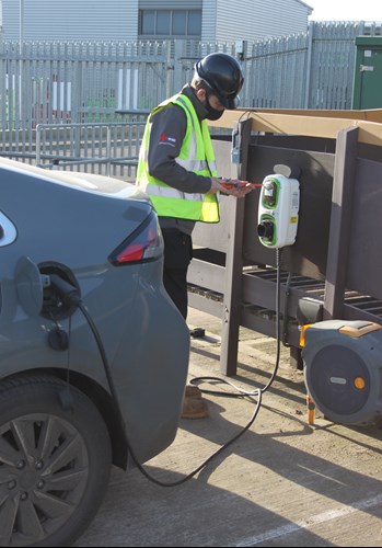 ABC Electrical Services staff member working at an electrical car charging point