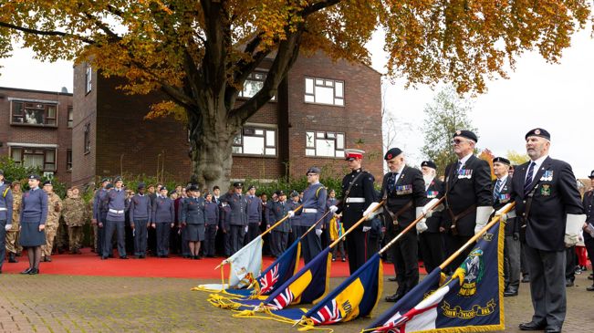 The Colour Party dipping the flags for the National Anthem.