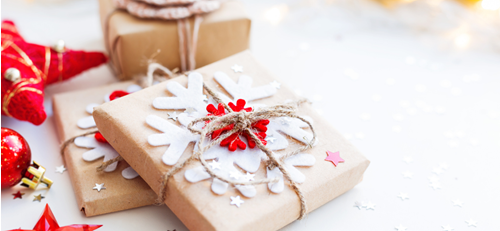 presents wrapped in brown paper with snowflake decoration tied up with string