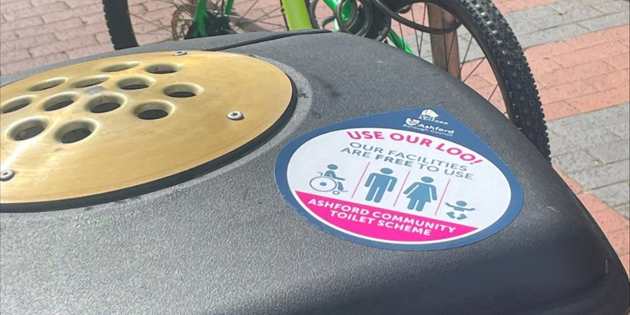 Image entitled New Community Toilet Scheme stickers placed throughout Ashford Town Centre