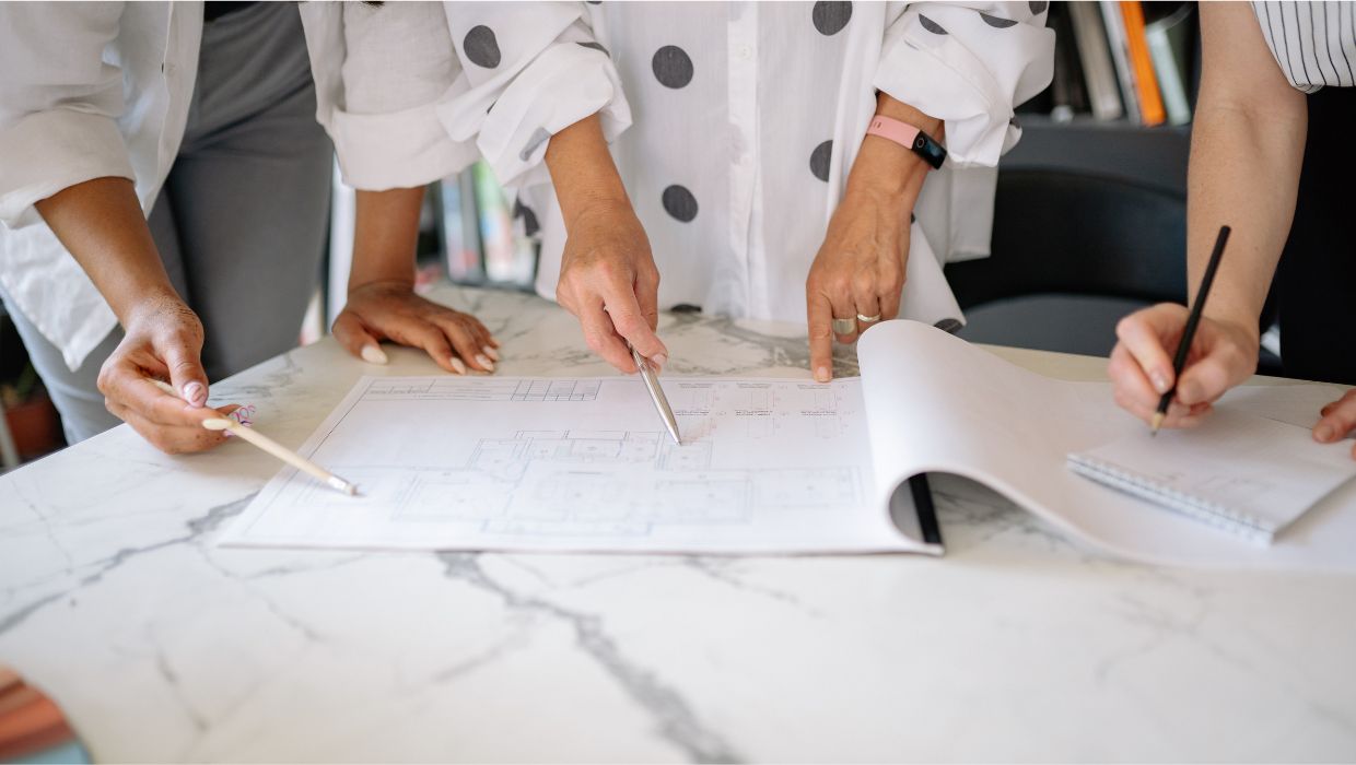 People looking at construction plans