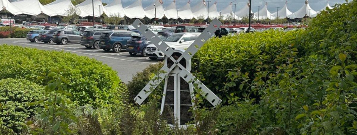 Bug Hotel windmill in plants at Ashford Designer Outlet