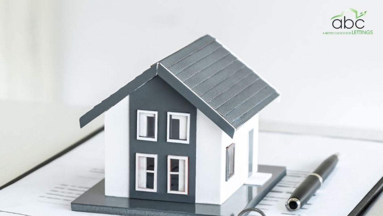 A picture of a toy house with the ABC Lettings logo in the top right hand corner
