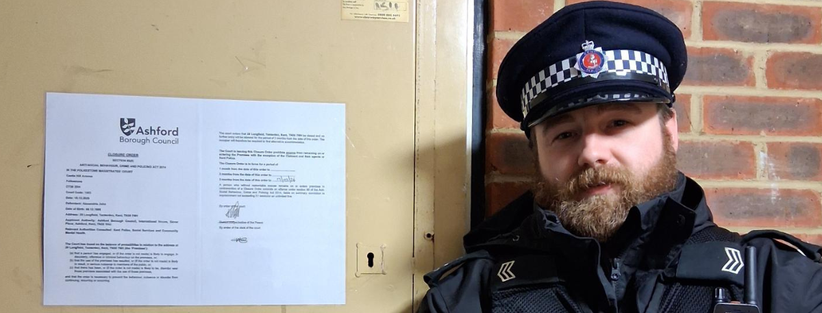 Image of policeman with Closure Order notice