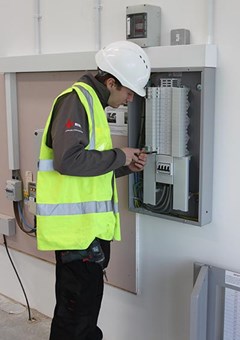 ABC Electrical Services electrician at work on a fuse box