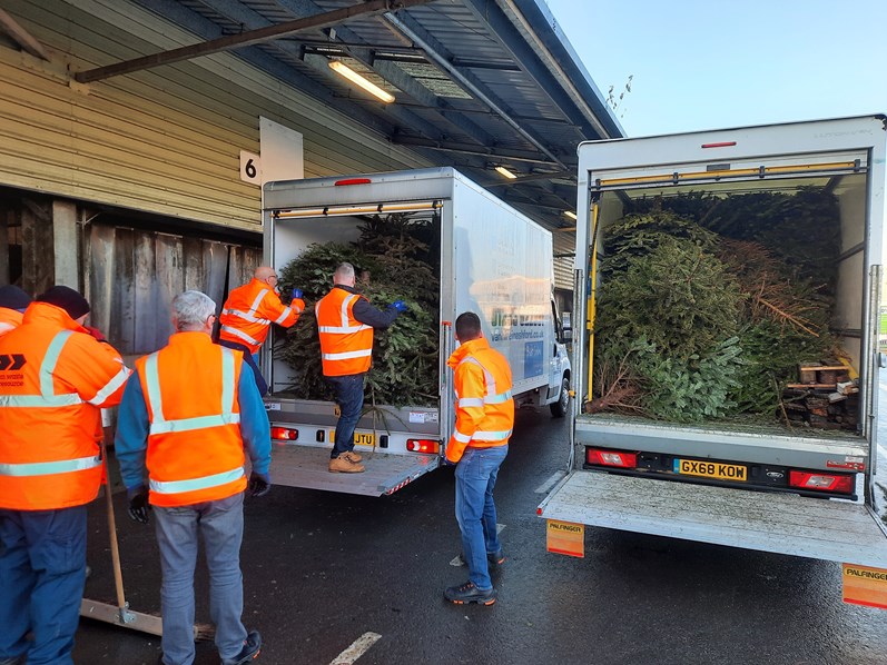 Givaudan Crew Volunteers in Ashford helping with Pilgrims Hospice Tree Recycling campaign