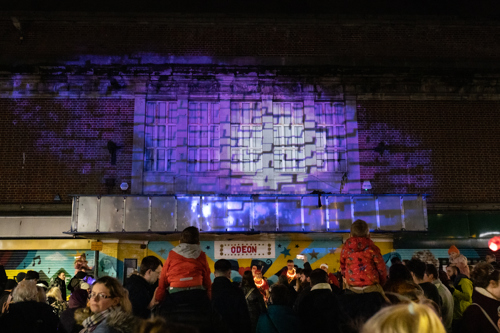 Lighting on the odeon building and crowd of people