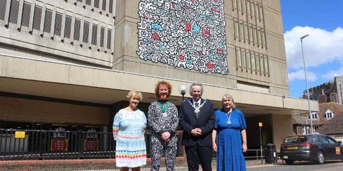 Tracey Kerly Chief Executive of Ashford Borough Council, Sam Cox ‘Mr Doodle’, Mayor of Ashford Cllr Larry Krause, Mayoress Revd Dr Sue Starkings standing in front of Mr Doodle's artwork
