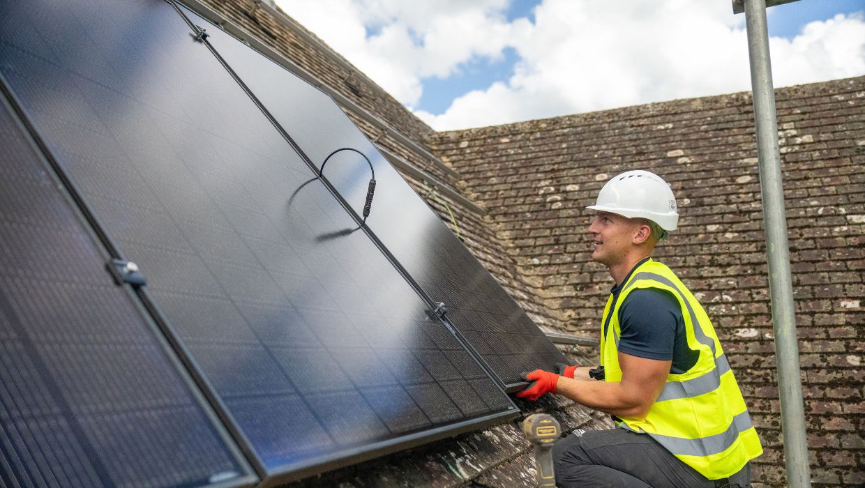 A man installing solar panels