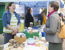 People talking at a stall