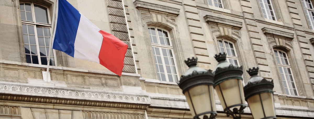 French flag flying outside an embassy building
