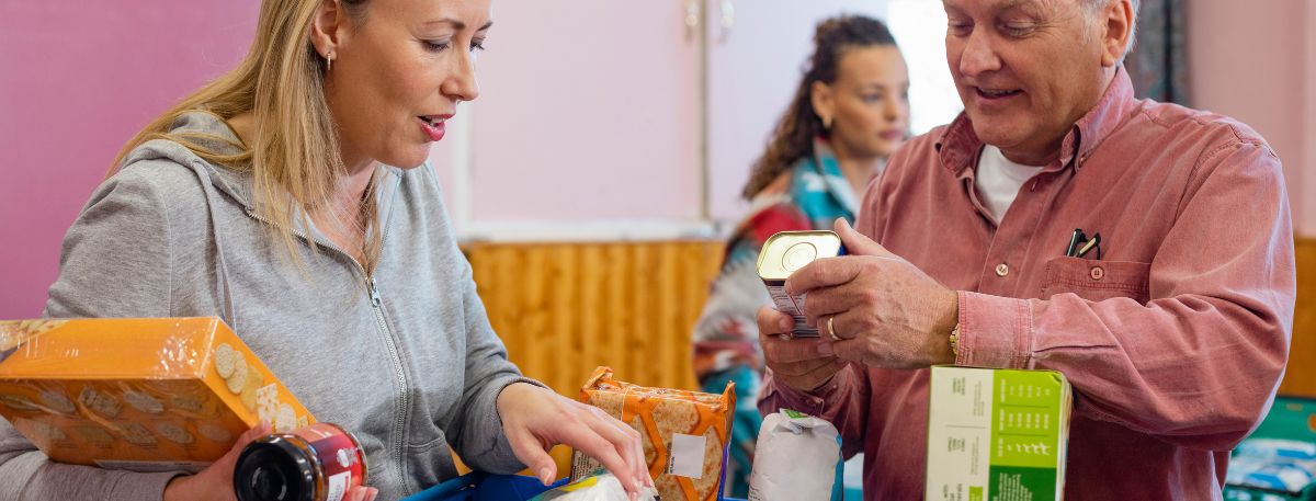 People looking at food items