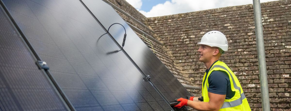 A man installing solar panels