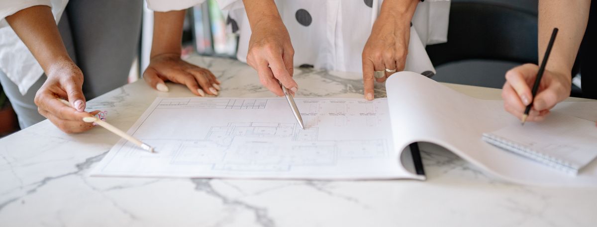 People looking at construction plans