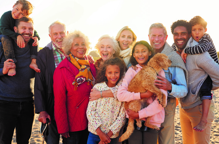 Diverse group of people happily taking a photo together