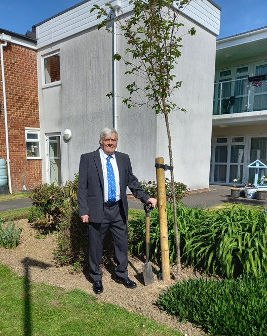 Luckly House resident Vic Lilley with a commemorative cherry blossom tree