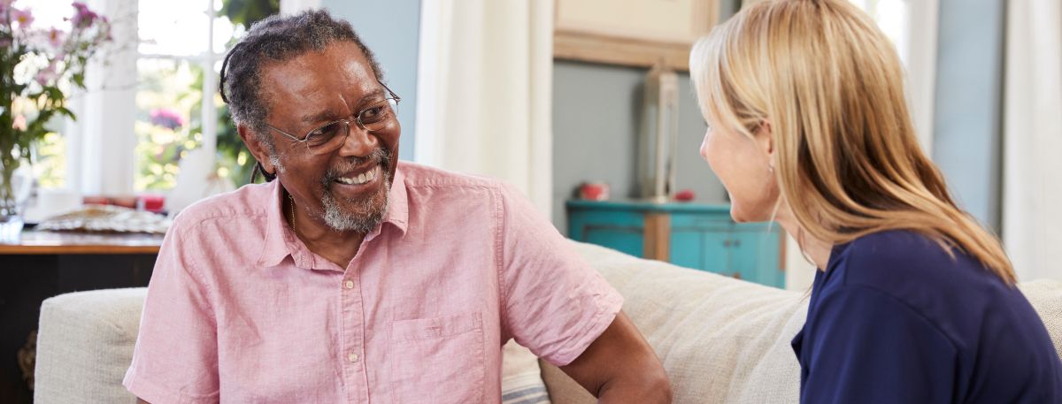 Woman offering support to a man during a friendly discussion