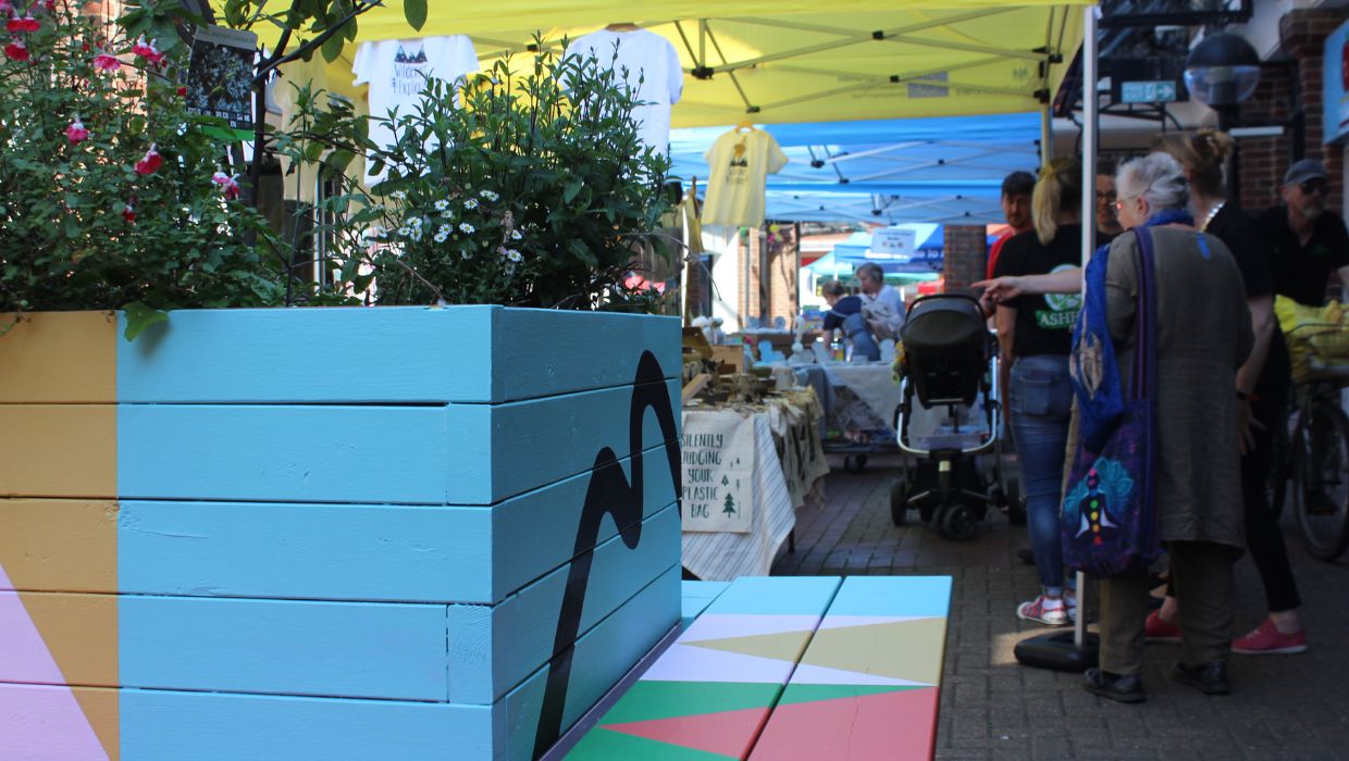 People waling through a market