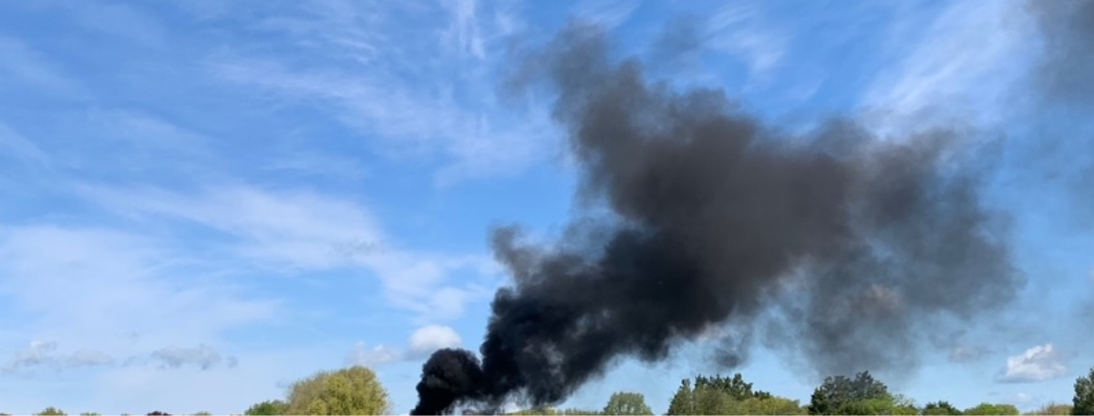 Image of black smoke from burning waste