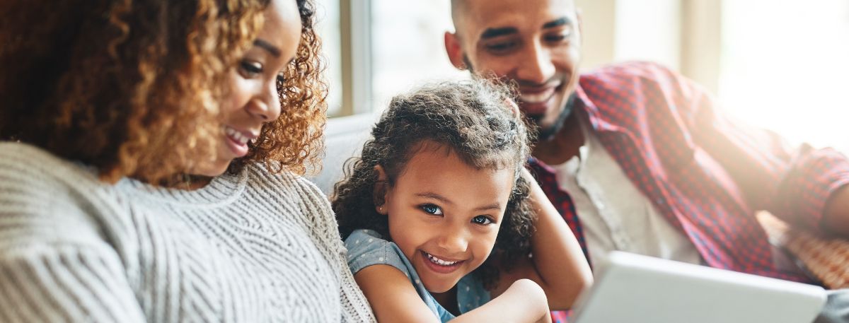 Family looking at a tablet device together