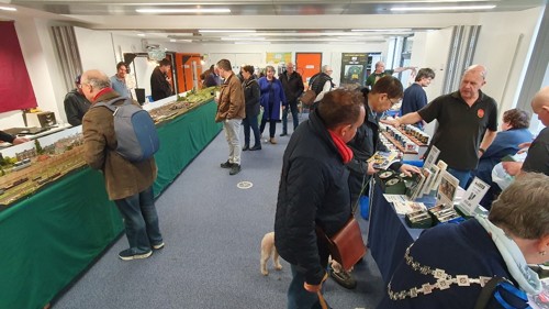 Visitors enjoying chatting to exhibitors on the heritage stands in Ashford college