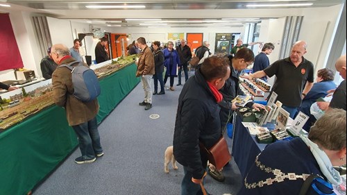 Visitors enjoying chatting to exhibitors on the heritage stands in Ashford college