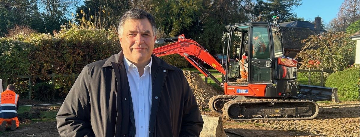 SEC Director Bill Hicks at the installation of the first septic tank