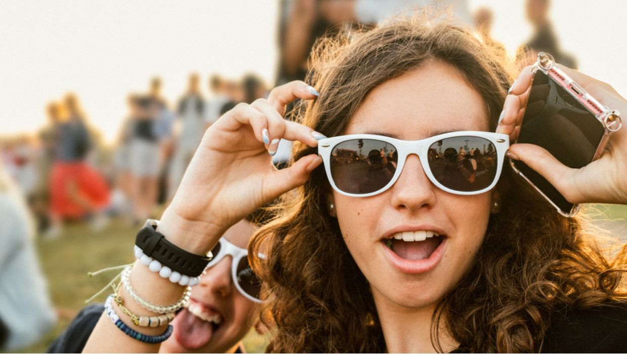 Young person having fun at a music festival tile